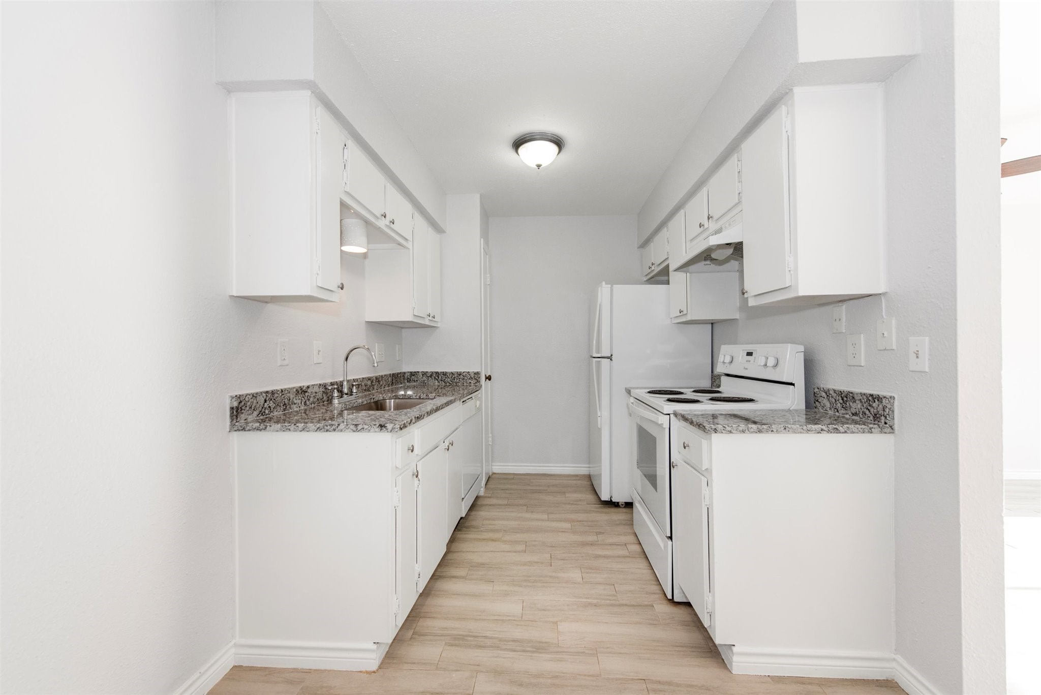 6200 West Tidwell Road, Unit 1613 Houston, TX 77092 - Photo 10 of 16 a kitchen with stainless steel appliances a sink stove and cabinets