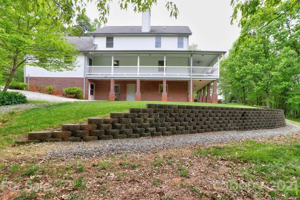 265 Deer Road Salisbury, NC 28146 - Photo 36 of 48 a front view of a house with a garden