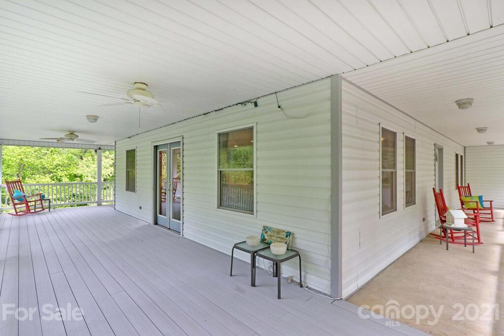 265 Deer Road Salisbury, NC 28146 - Photo 5 of 48 a view of a patio with table and chairs near a garden