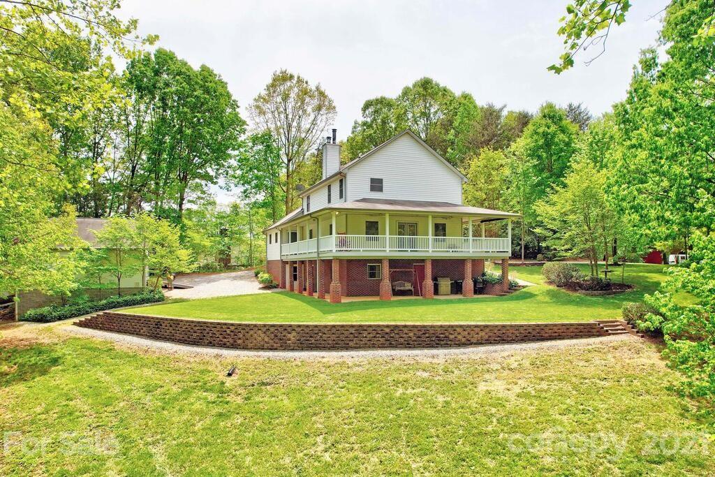 265 Deer Road Salisbury, NC 28146 - Photo 41 of 48 a front view of a house with a yard and trees