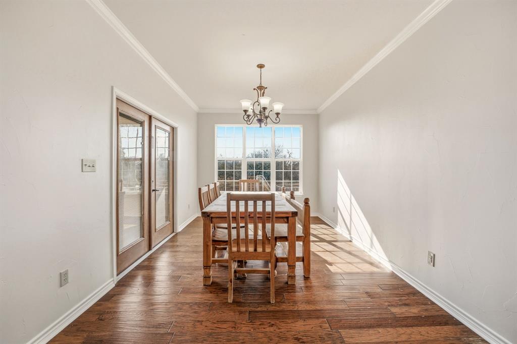 1114 Elk Ridge Drive Stephenville, TX 76401 - Photo 10 of 32 a view of a dining room with furniture window and wooden floor