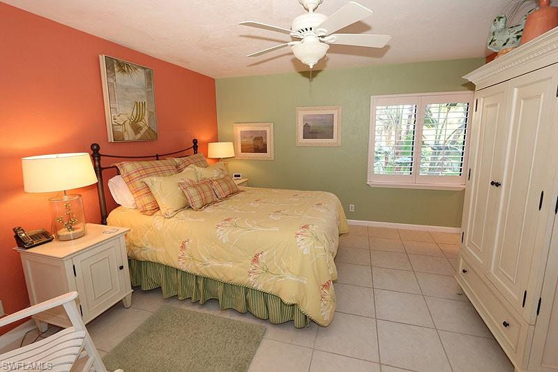 341 3rd Avenue South, Unit 341 Naples, FL 34102 - Photo 13 of 18 a bedroom with a bed and a window