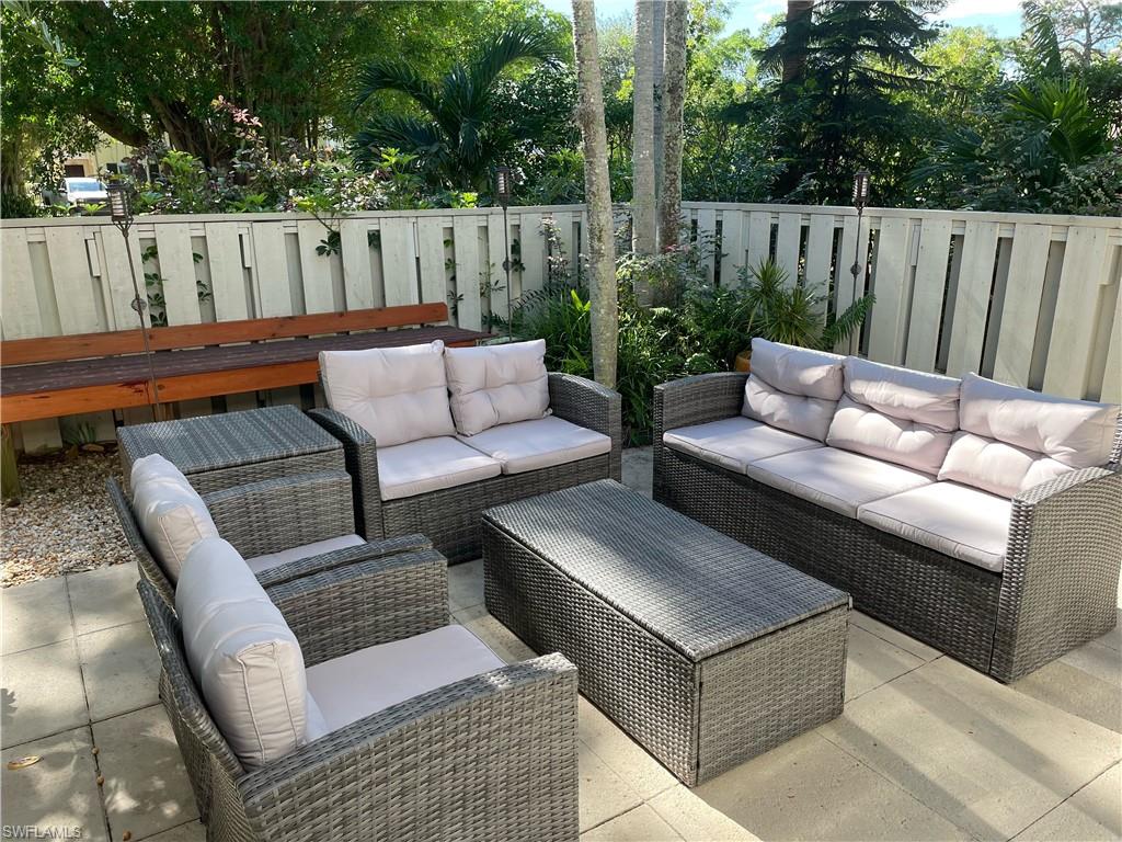 341 3rd Avenue South, Unit 341 Naples, FL 34102 - Photo 3 of 18 a view of patio with a couch
