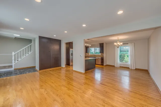 a view of kitchen with refrigerator and window