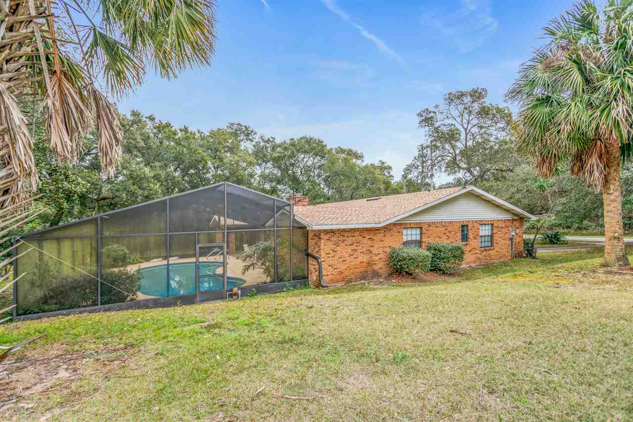 480 Vaill Point Road St. Augustine, FL 32086 - Photo 11 of 11 a front view of a house with a yard and garage
