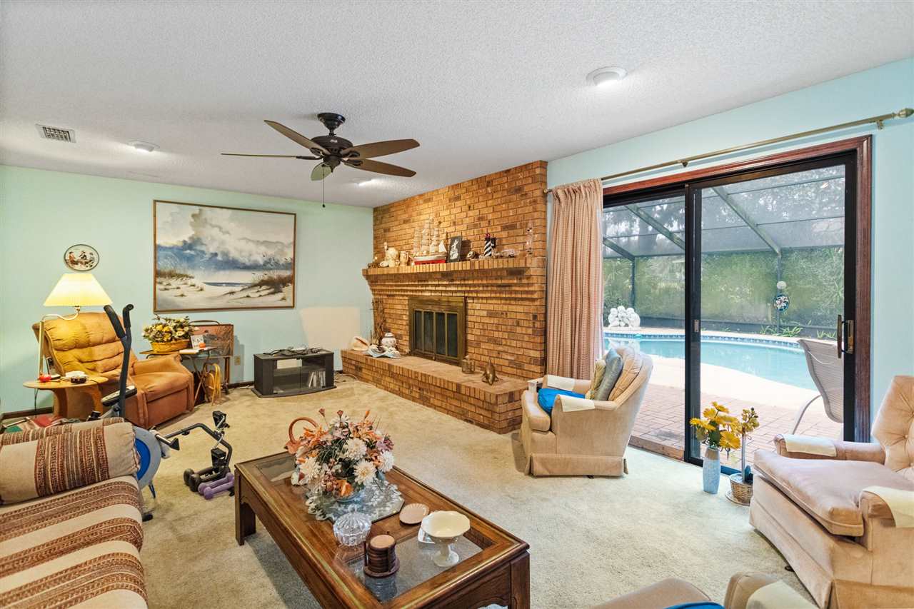 480 Vaill Point Road St. Augustine, FL 32086 - Photo 5 of 11 a living room with furniture large window and flat screen tv