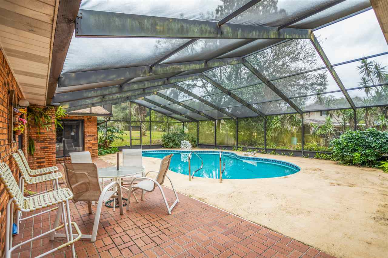 480 Vaill Point Road St. Augustine, FL 32086 - Photo 10 of 11 a view of a swimming pool with a patio