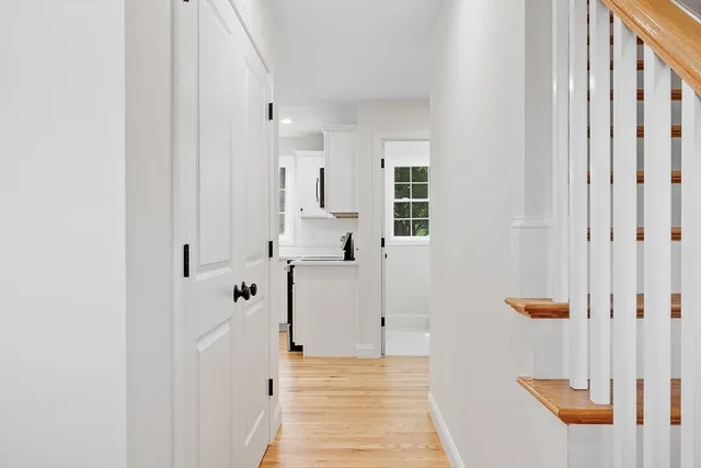 a view of a hallway with white walls
