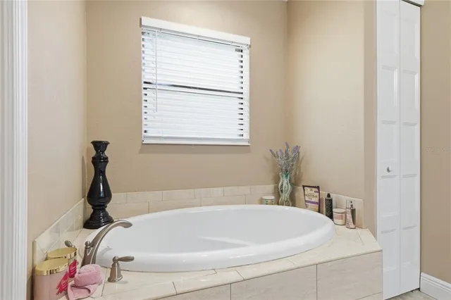 a bath tub sitting next to a window