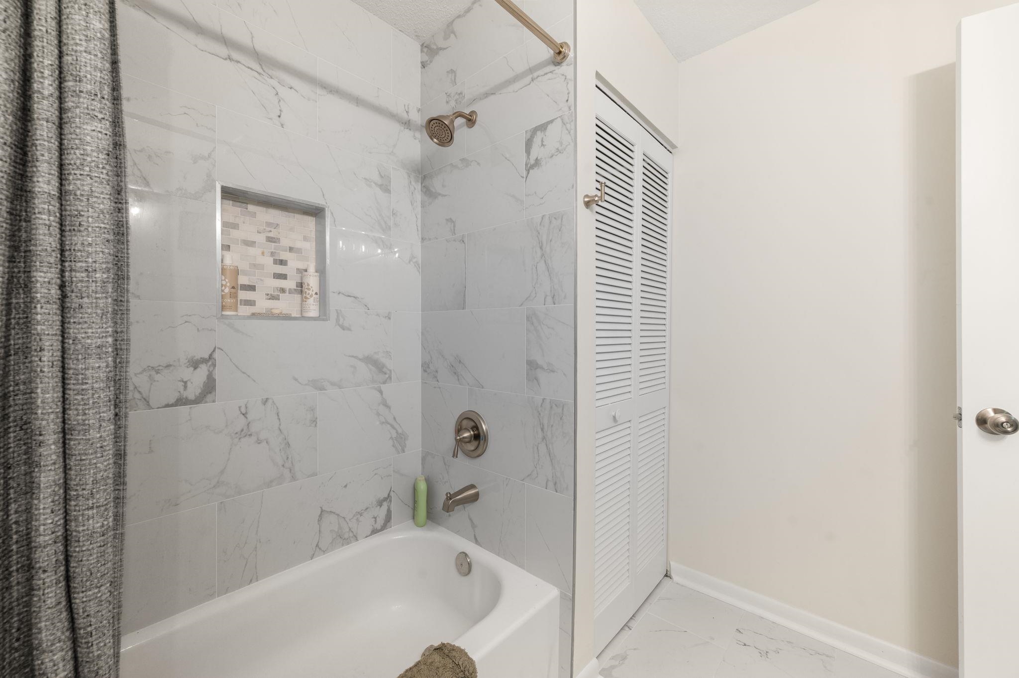 507 Gentian Road St. Augustine, FL 32086 - Photo 37 of 82 a bathroom with a bathtub and shower
