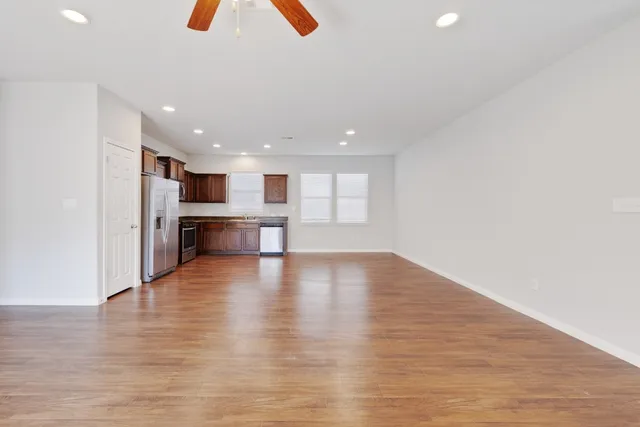 a view of kitchen with furniture and wooden floor