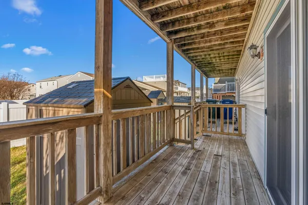 a view of a balcony with wooden floor