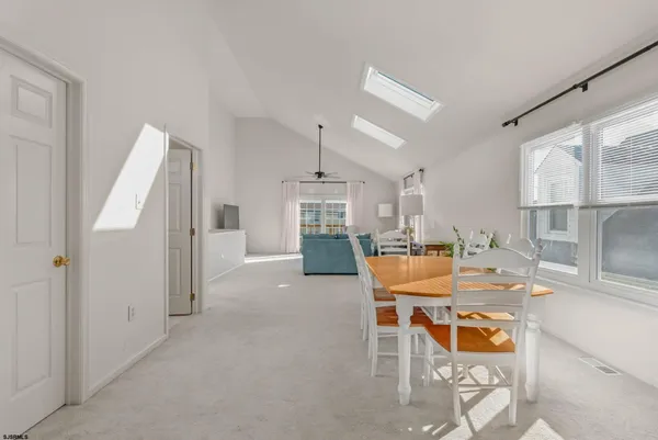 a outdoor space with a table and chairs