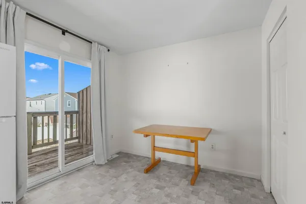 a chair and door in a room