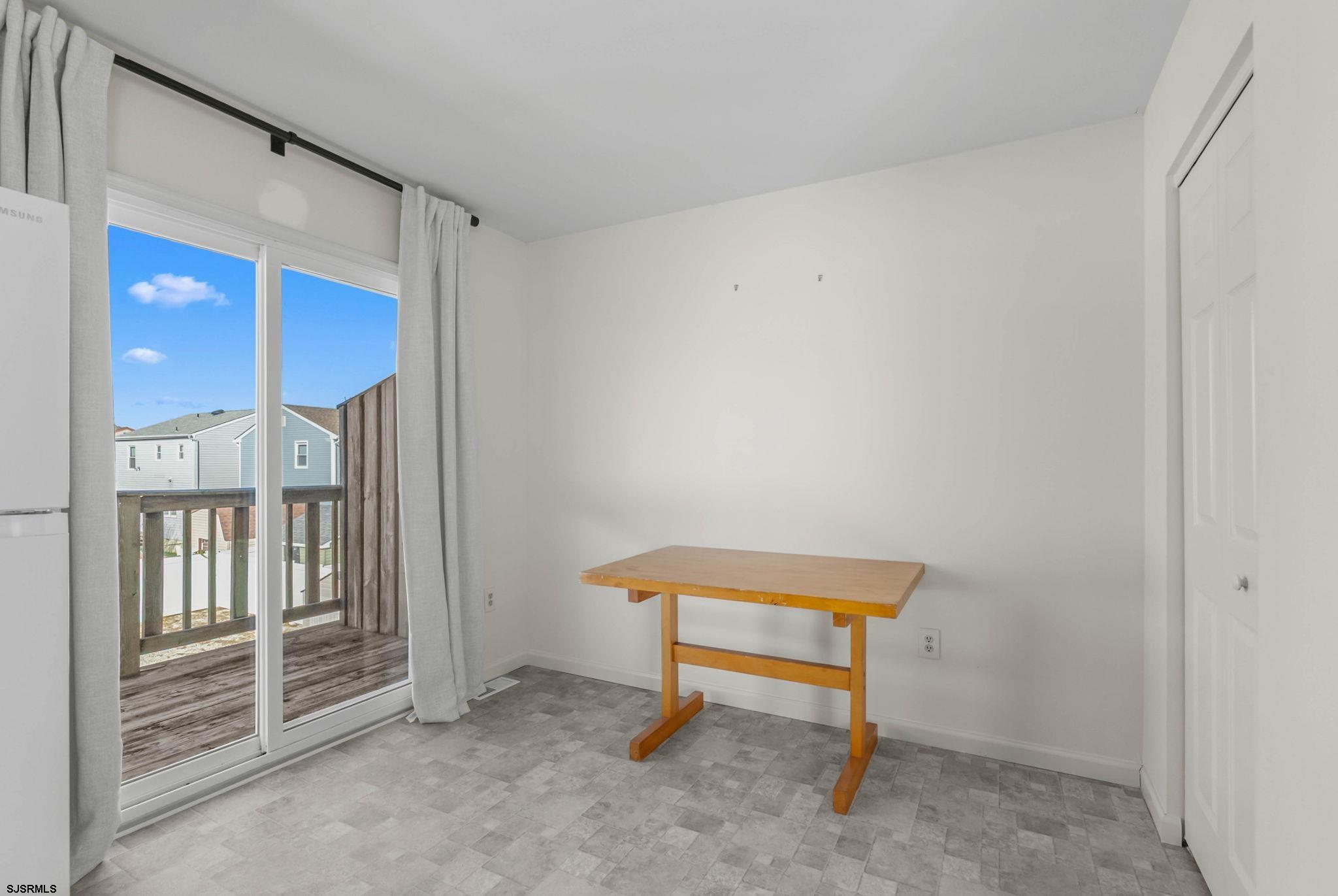 413 West Beach Avenue, Unit B Brigantine, NJ 08203 - Photo 25 of 30 a chair and door in a room