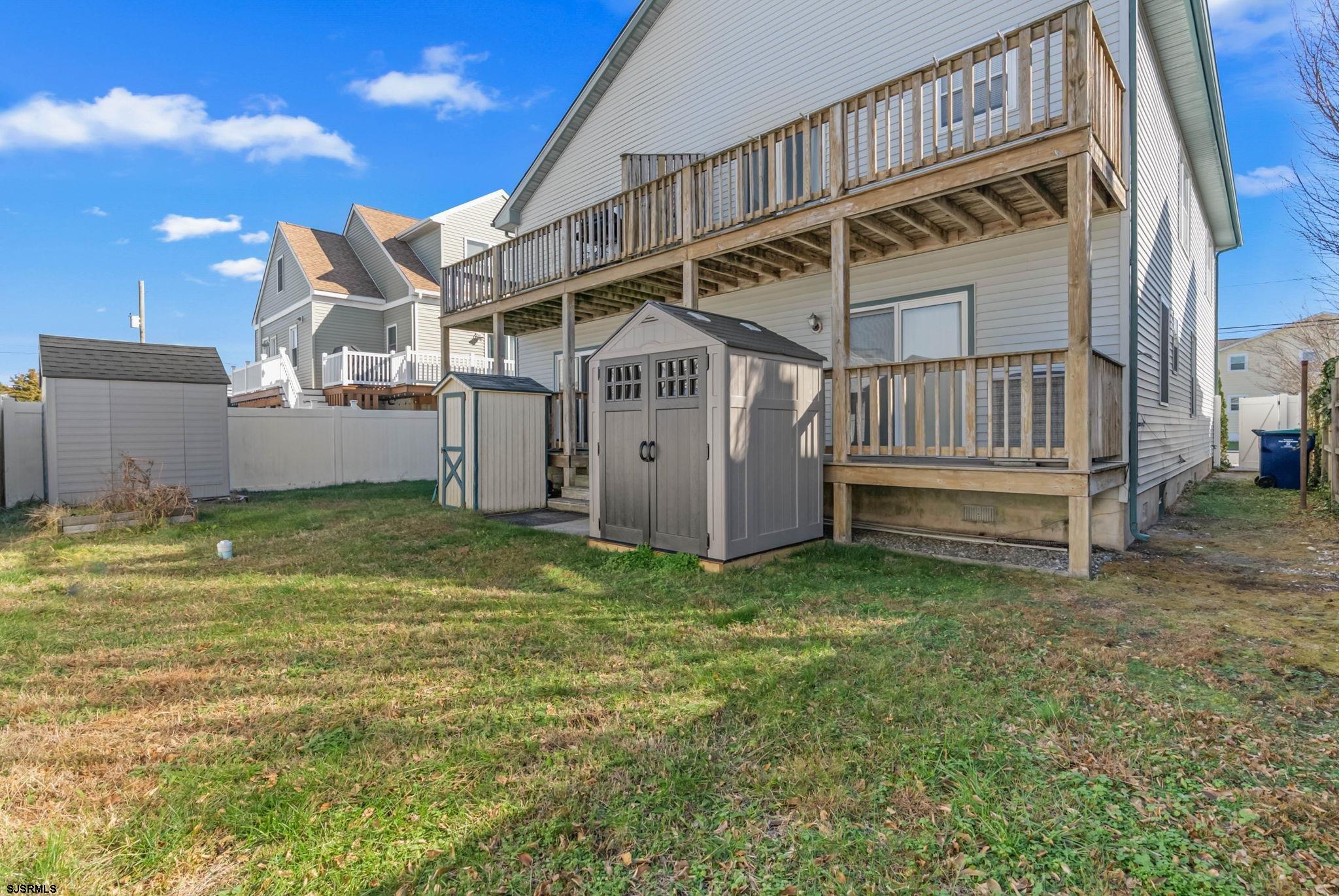 413 West Beach Avenue, Unit B Brigantine, NJ 08203 - Photo 28 of 30 a view of a house with a yard