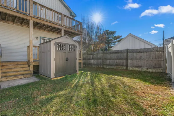 a view of a white house with a outdoor space