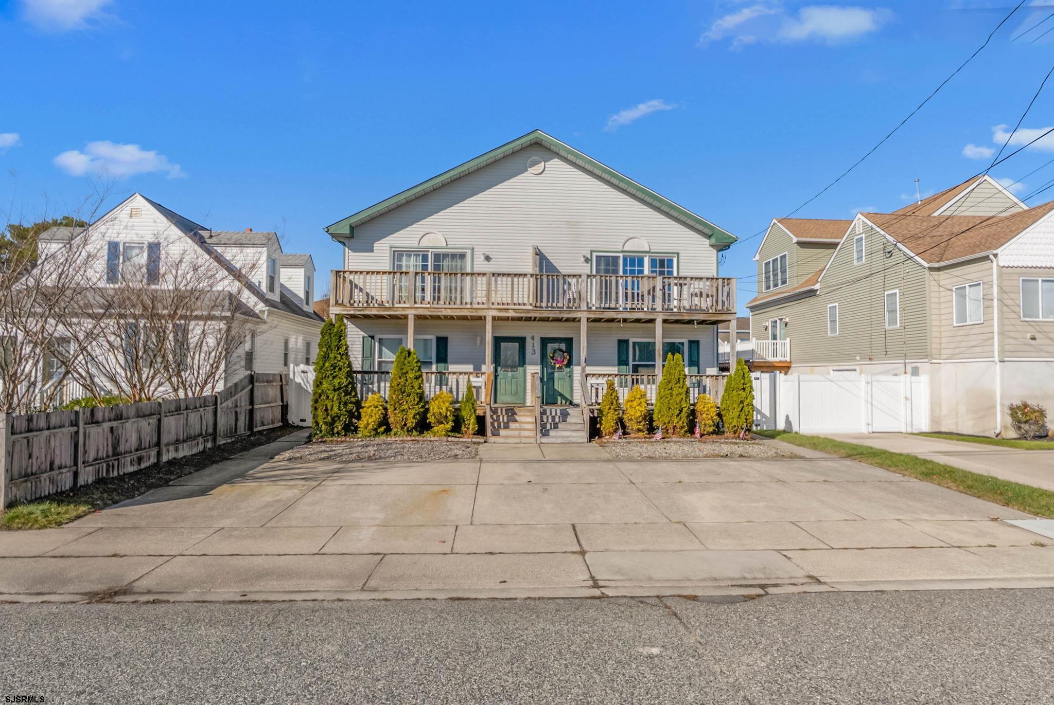 413 West Beach Avenue, Unit B Brigantine, NJ 08203 - Photo 30 of 30 a view of a white house with a outdoor space