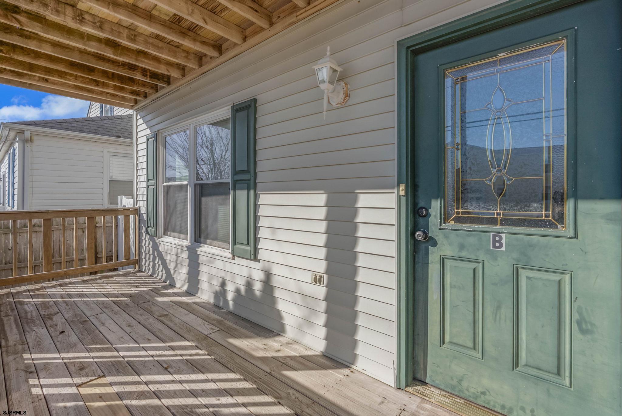 413 West Beach Avenue, Unit B Brigantine, NJ 08203 - Photo 4 of 30 a view of a balcony with a door