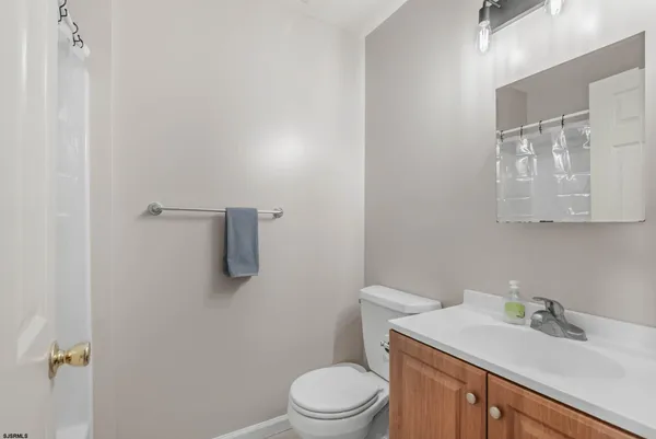 a bathroom with a sink toilet and vanity