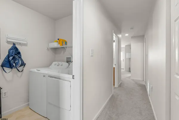 a view of storage and utility room with a sink