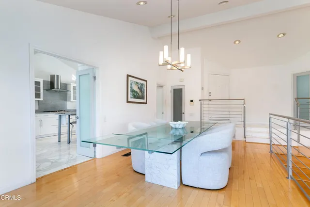 a living room with fireplace furniture and a dining table