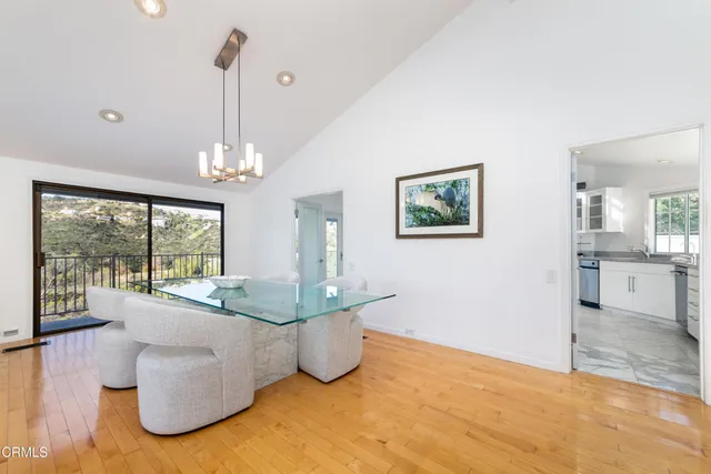 a view of a livingroom with furniture window and wooden floor