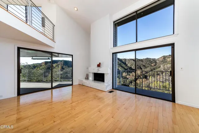a view of an entryway with wooden floor