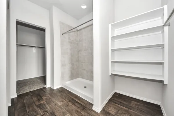 a bathroom with a bathtub and a shower