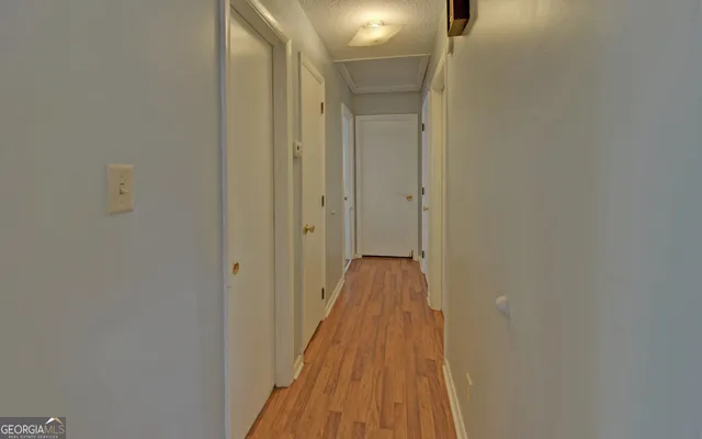 a view of a bathroom from the hallway