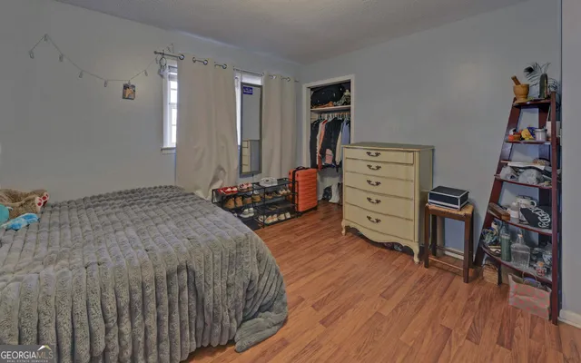 a bed room with a bed and a book shelf