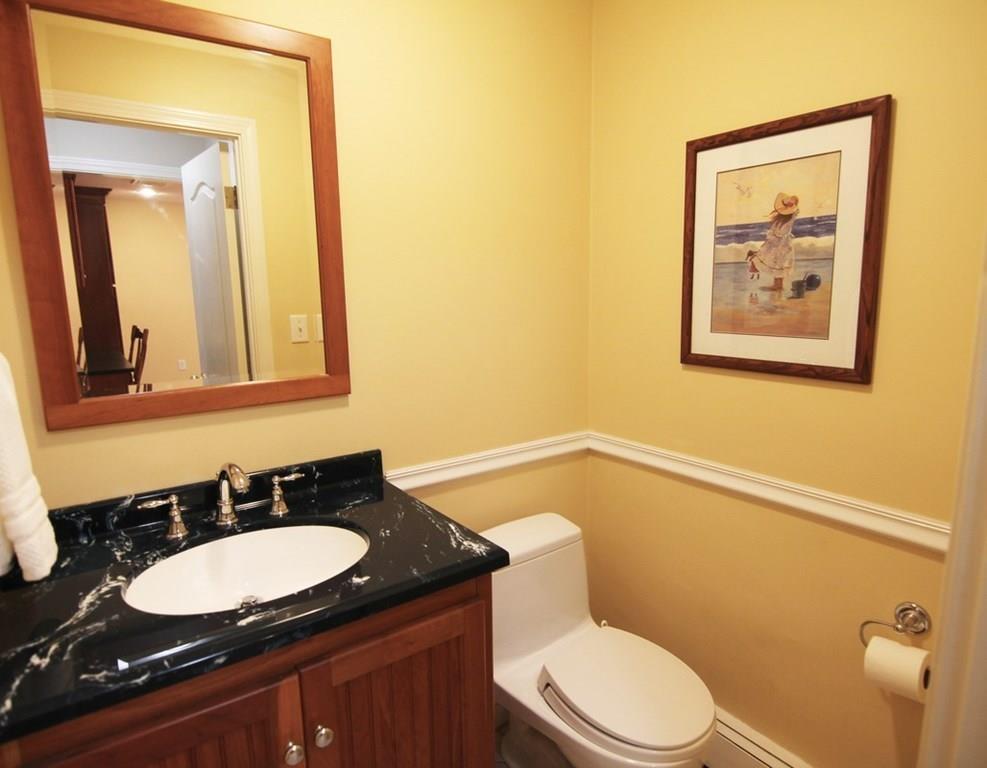 4 Paddock Lane Lexington, MA 02421 - Photo 13 of 25 a bathroom with a granite countertop sink mirror vanity and toilet