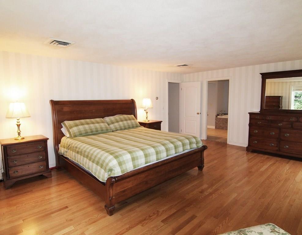 4 Paddock Lane Lexington, MA 02421 - Photo 14 of 25 a bedroom with a bed and window