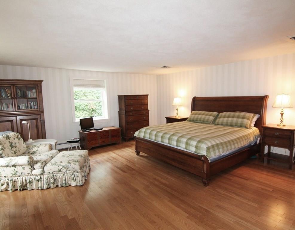 4 Paddock Lane Lexington, MA 02421 - Photo 15 of 25 a bedroom with a bed window and couch