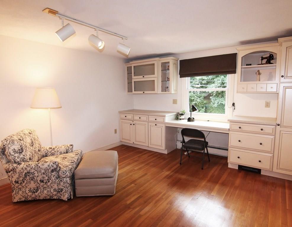 4 Paddock Lane Lexington, MA 02421 - Photo 18 of 25 a living room with furniture and a window