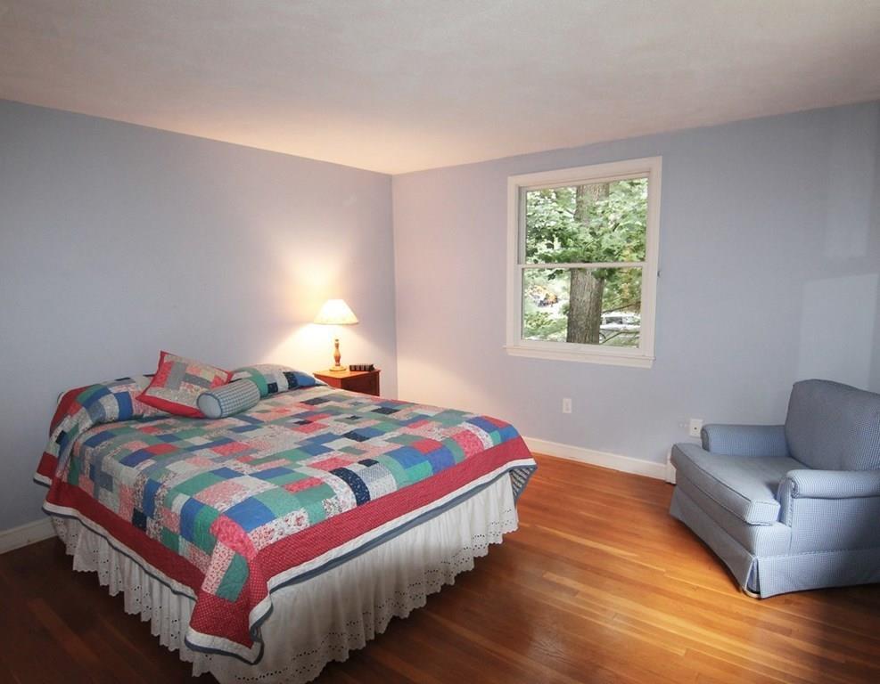 4 Paddock Lane Lexington, MA 02421 - Photo 20 of 25 a bedroom with a bed and window