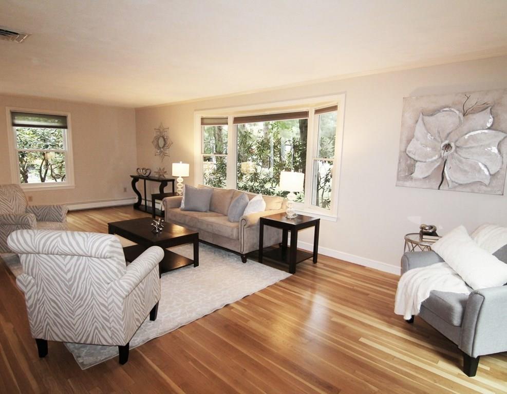 4 Paddock Lane Lexington, MA 02421 - Photo 5 of 25 a living room with furniture and a window