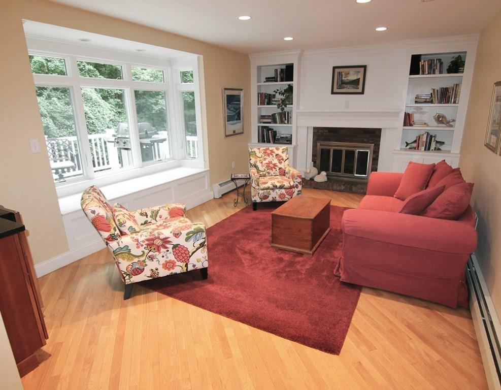 4 Paddock Lane Lexington, MA 02421 - Photo 10 of 25 a living room with furniture fireplace and a large window