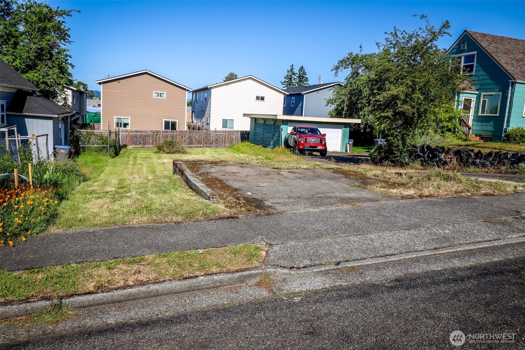 0 Scott Avenue Bremerton, WA 98310 - Photo 11 of 23 a front view of a house with a yard and garage