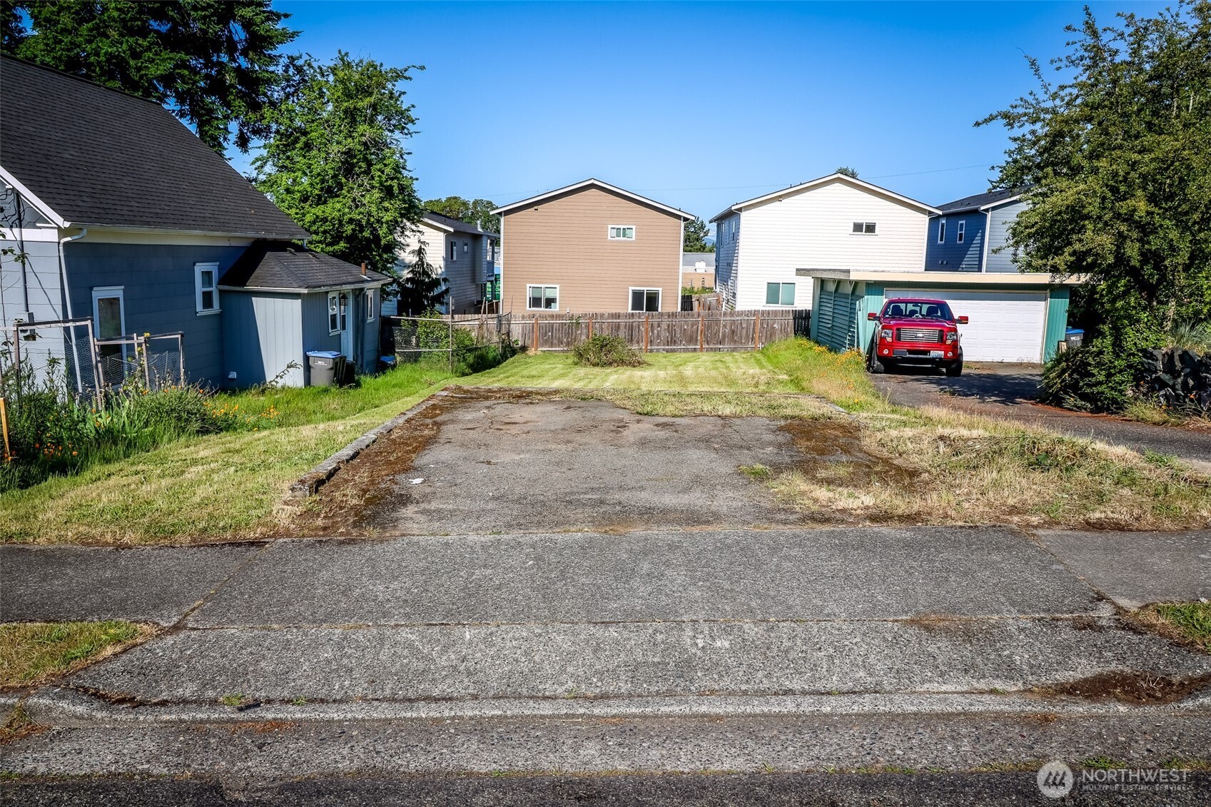 0 Scott Avenue Bremerton, WA 98310 - Photo 10 of 23 a car parked in front of a house with a yard