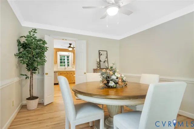 a view of a dining room with furniture and window