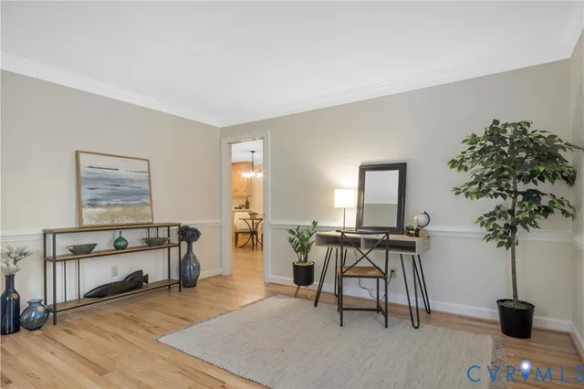 a view of a livingroom with furniture and a potted plant