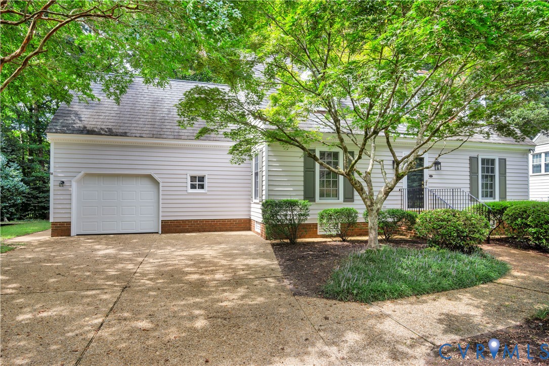 140 Seton Hill Road Williamsburg, VA 23188 - Photo 2 of 40 a front view of a house with a yard and garage