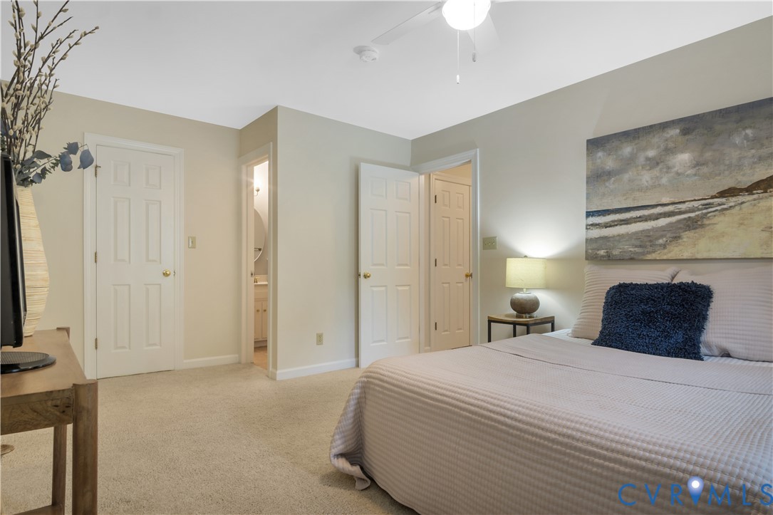 140 Seton Hill Road Williamsburg, VA 23188 - Photo 26 of 40 a bedroom with a bed and a painting on the wall