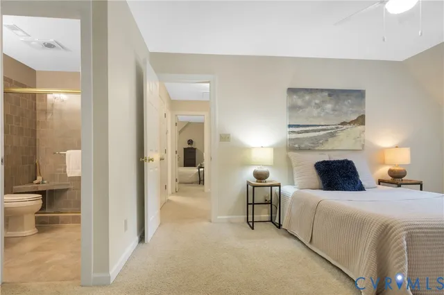 a bedroom with a bed and a view of bathroom