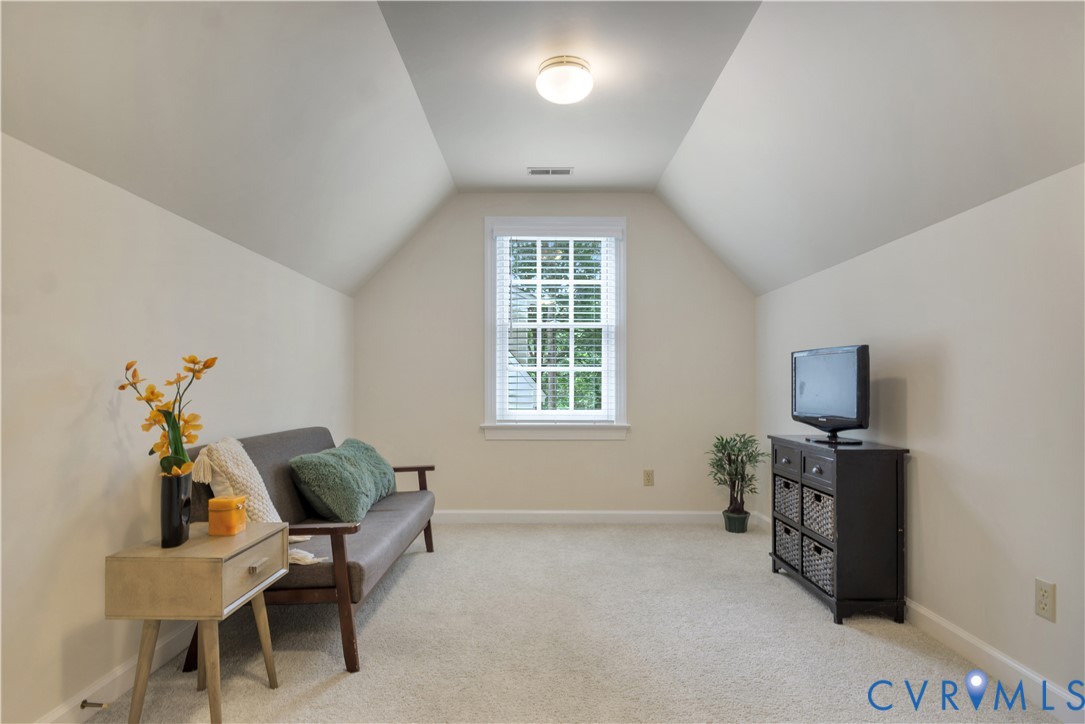 140 Seton Hill Road Williamsburg, VA 23188 - Photo 29 of 40 a living room with furniture and a flat screen tv