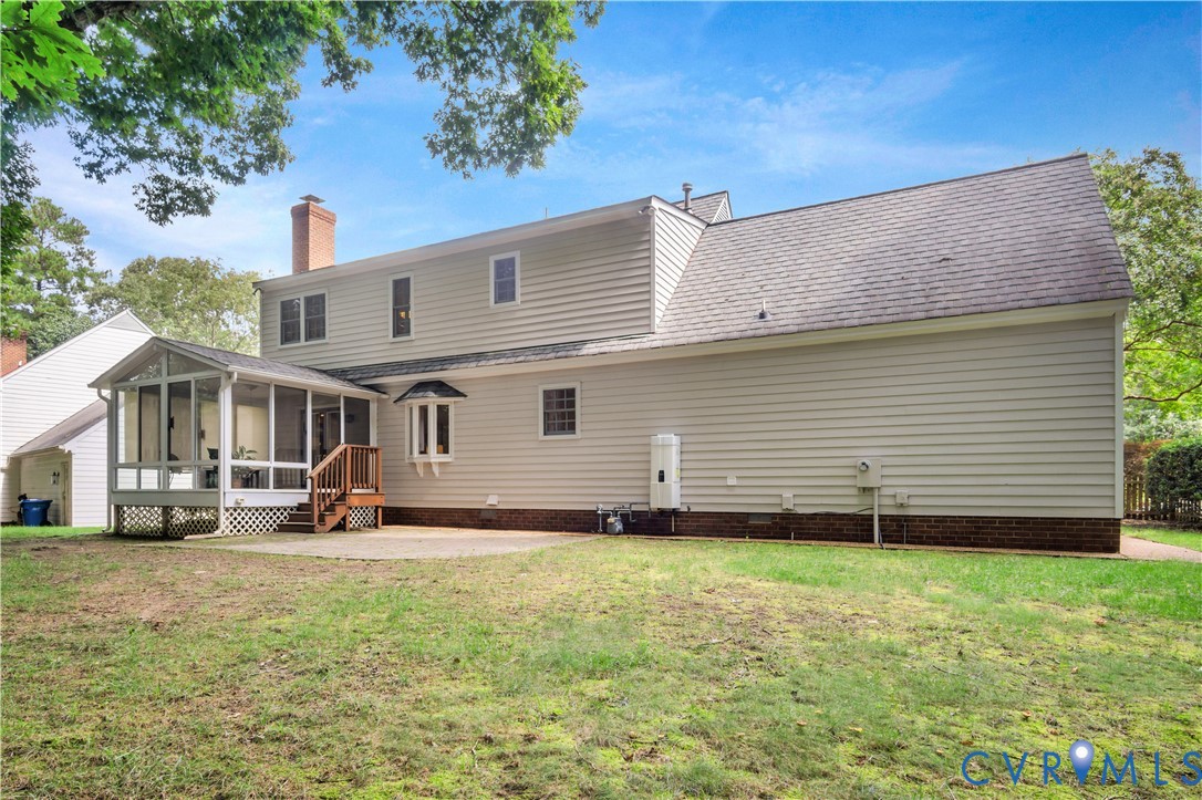140 Seton Hill Road Williamsburg, VA 23188 - Photo 34 of 40 a front view of a house with a yard and garage