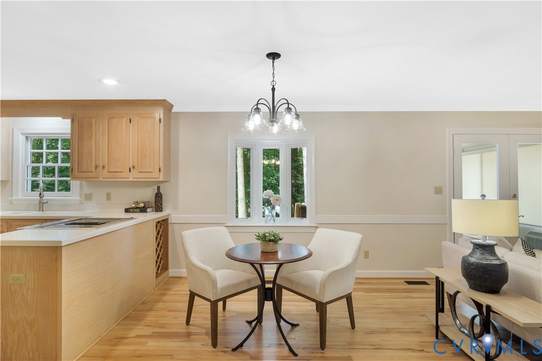 140 Seton Hill Road Williamsburg, VA 23188 - Photo 8 of 40 a kitchen with a table and chairs in it