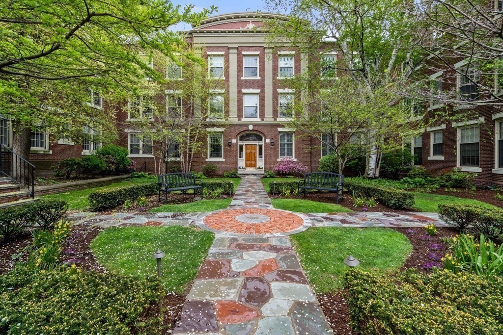 135 Beaconsfield Road, Unit 2 Brookline, MA 02445 - Photo 11 of 33 front view of a brick house with a yard