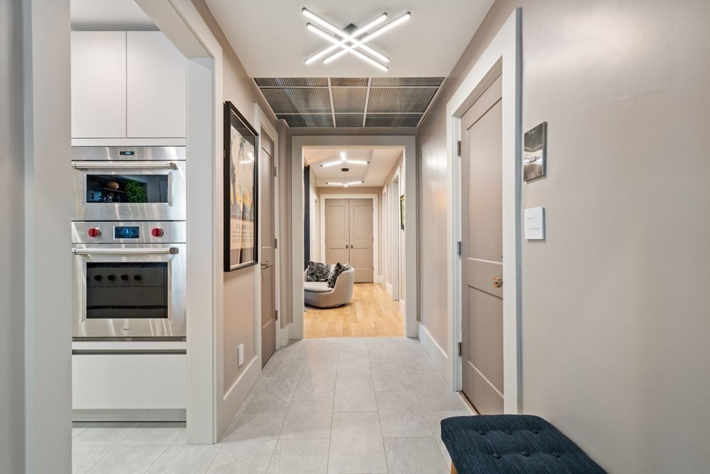 135 Beaconsfield Road, Unit 2 Brookline, MA 02445 - Photo 12 of 33 a view of a hallway and a livingroom with furniture